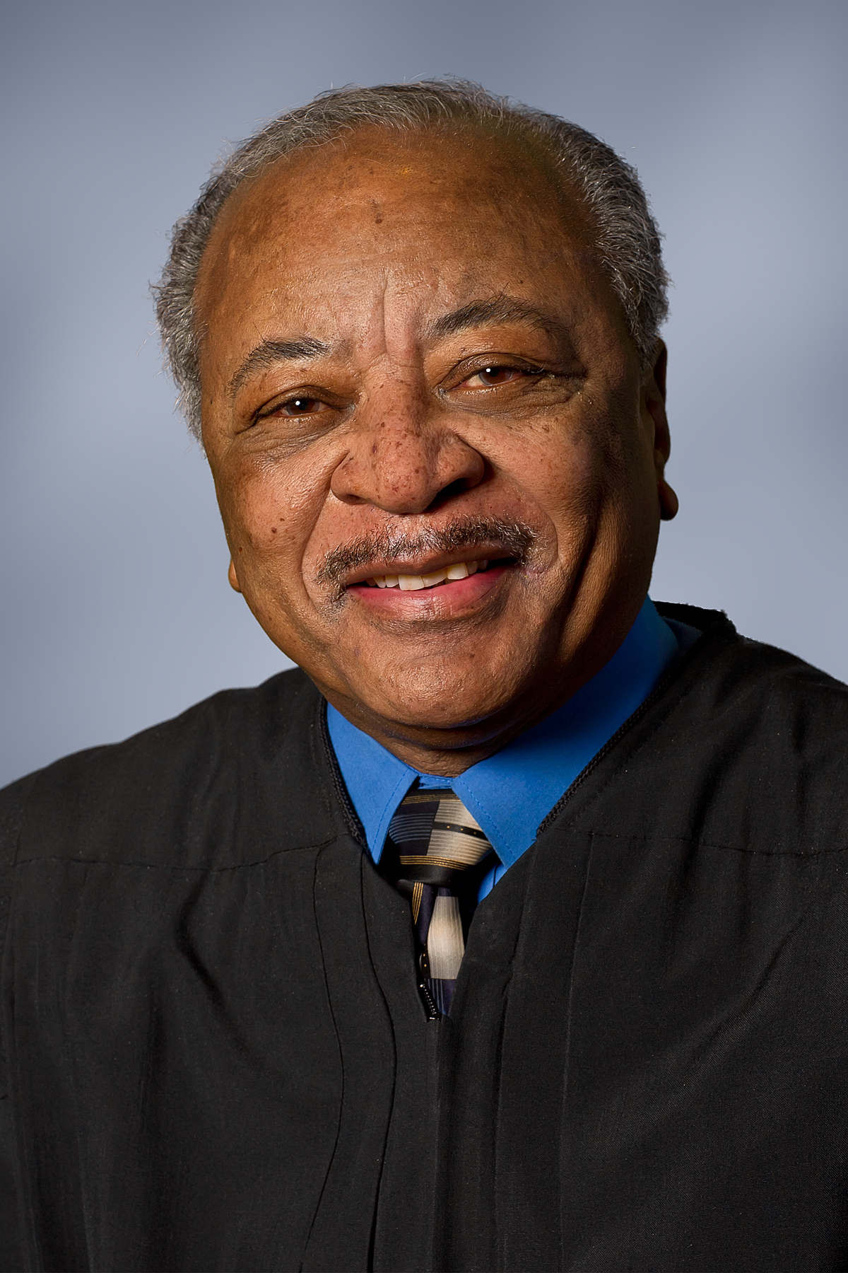 Headshot of Judge Bonner, smiling in a judicial robe