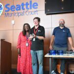 Kevan Johnson (center) with Seattle Municipal Court Presiding Judge Anita Crawford-Willis and Court Administrator Josh Sattler